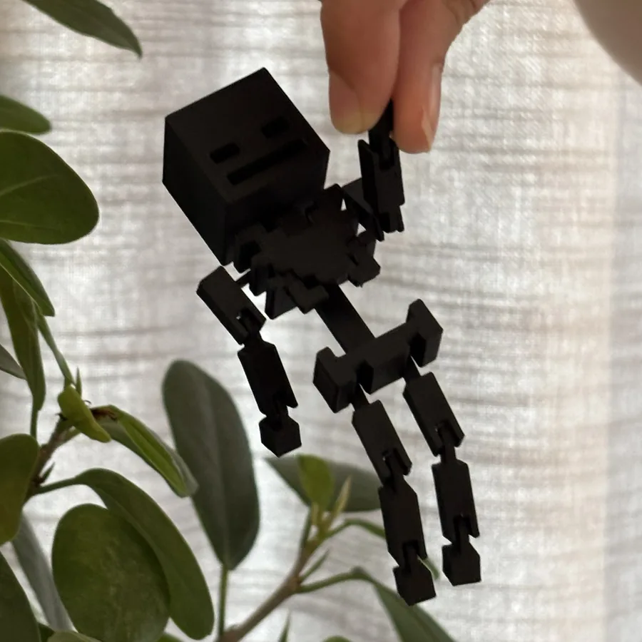 Melns 3D drukāts skelets ar kustīgām rokām un kājām